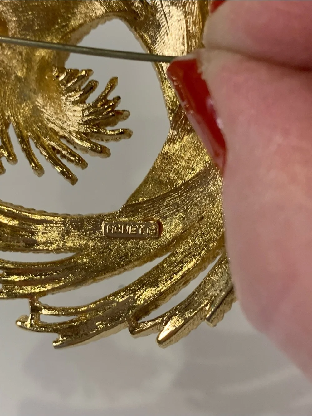 Vintage Monet Gold Tone Textured Swirl Brooch